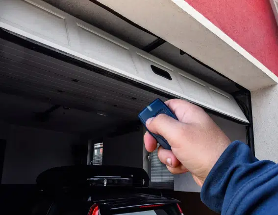 Opening a garage door using a remote.